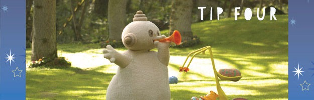 Tip Four. A beige character, holding an orange horn close to it's mouth, is standing in the middle of a green park.
