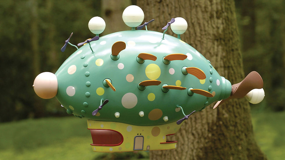 a small, green flying machine with spinning propellors and waving fins to help it float in the air